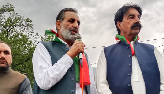 Pakistan Tehreek-i-Insaf MPA Munir Hussain Lughmani (left) addresses the public gathering on April 27, 2024. — Facebook/Munir Hussain Lughmani