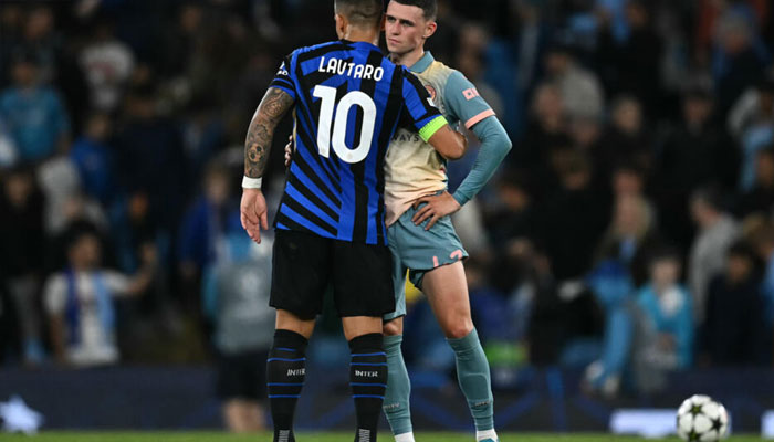 Inter Milan striker Lautaro Martinez greets Manchester City midfielder Phil Foden at the end of their Champions League match on September 18, 2024 at the Etihad Stadium in Manchester. — AFP