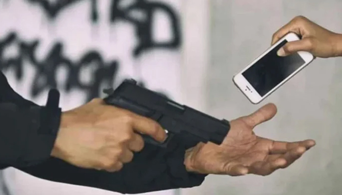 A representational image of a person robbing another at gun point. — APP/File