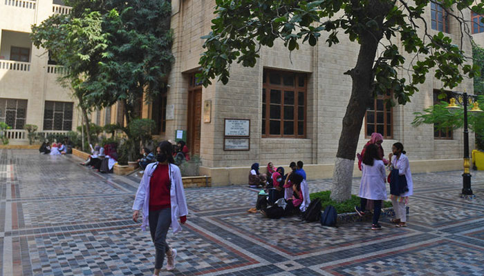 Students gather at a yard of the Dow University of Health Sciences, in Karachi on January 13, 2022. — AFP