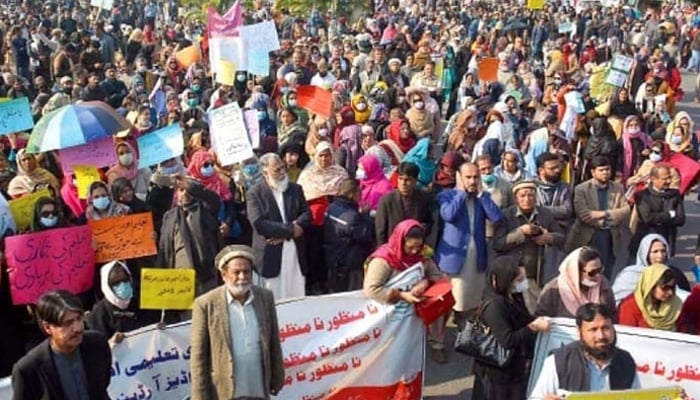 A representational image of teachers holding a protest with placards and banners in Islamabad. — INP/File