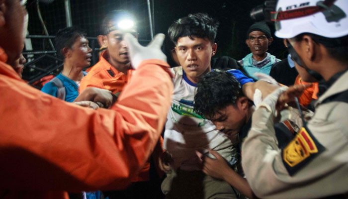Search and rescue members return from the site of a landslide that killed at least 15 people as search and rescue operations continue at an illegal gold mining site in Solok, West Sumatra on September 28, 2024. — AFP