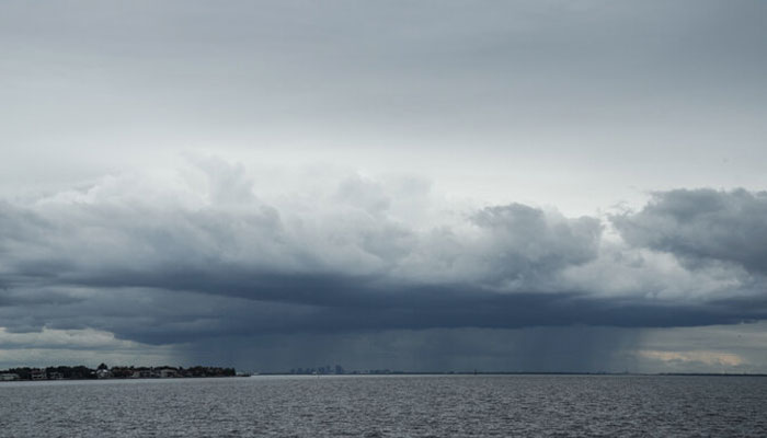 A thunderstorm can be seen moving over Tampa in the distance from St. Petersburg, Florida ahead of Hurricane Miltons expected landfall in the middle of this week on October 8, 2024. — AFP