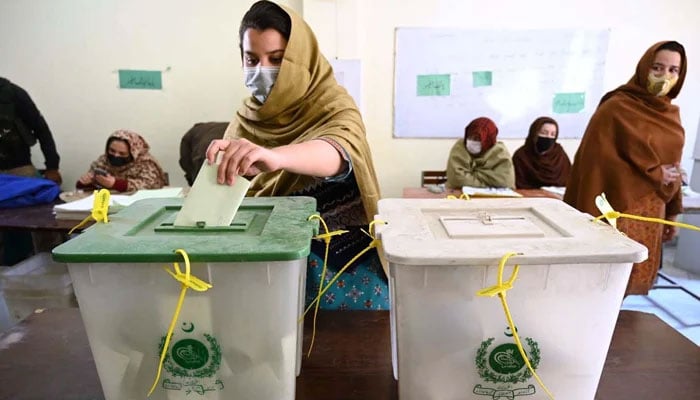 A voter casts her vote in a polling station during General Election 2024 on February 8, 2024. — APP