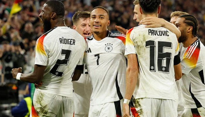 Germanys number seven Jamie Leweling celebrates with teammates after scoring against the Netherlands.—AFP/file