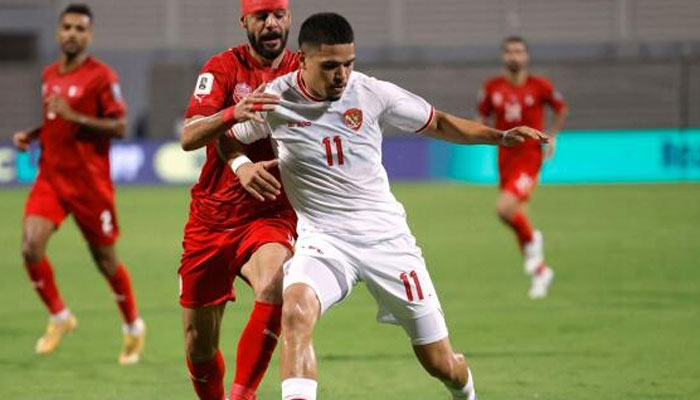 Bahrains Waleed Al Hayam in action with Indonesias Ragnar Oratmangoen in the Group C third round match of the World Cup Asian Qualifiers at the Bahrain National Stadium in Riffa on October 10, 2024. — Reuters/file