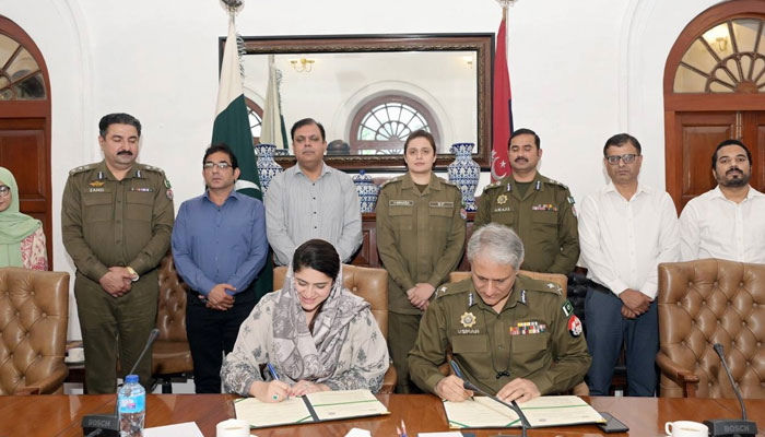Chairperson Child Protection and Welfare Bureau Sara Ahmed (left) and IGP Punjab Dr Usman Anwar (right) sign an MOU in this image released on October 17, 2024. — Facebook/Punjab Police Pakistan