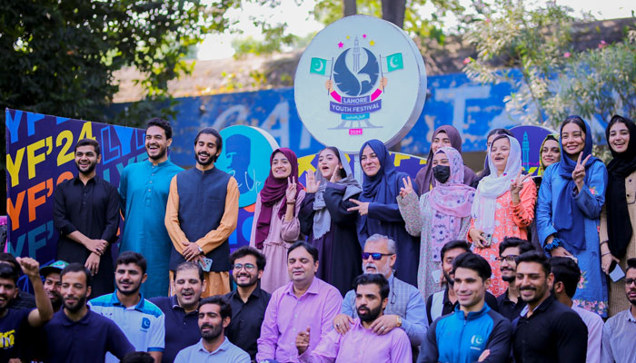 The image shows a group photo at the Lahore Youth Festival at Punjab Stadium on Oct 18, 2024. — Facebook@LahoreYouthFestival