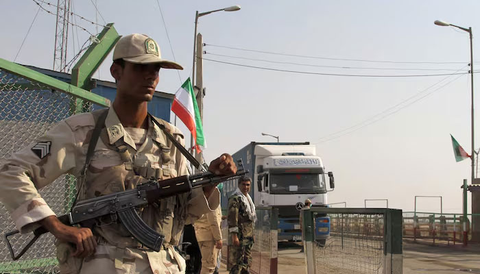 A representational image showing an Iranian security personnel standing guard at a border crossing. — AFP/File
