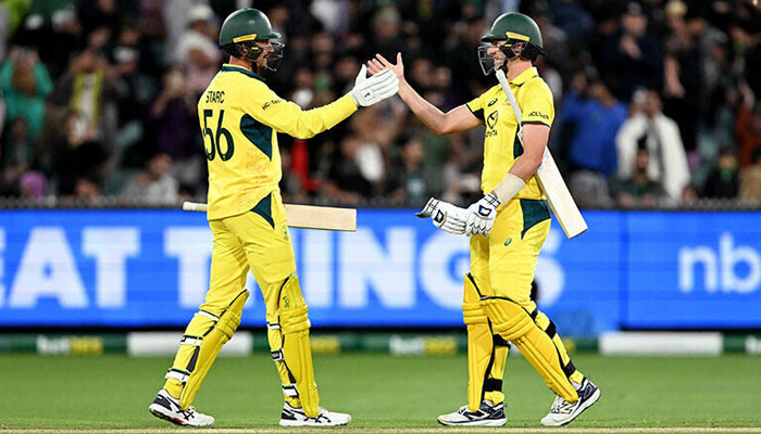 Australian batsman Pat Cummins (R) is congratulated by teammate Mitchell Starc after hitting the winning run during the first one-day International cricket match between Australia and Pakistan at the Melbourne Cricket Ground in Melbourne on November 4. — AFP