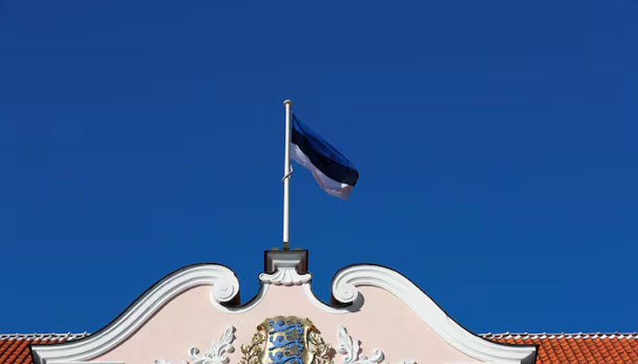 A national flag flutters over Estonian Parliament in Tallinn, Estonia on April 4, 2019. — Reuters