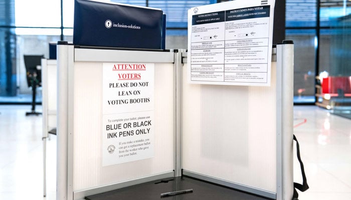 People cast their votes at an early voting site at the Martin Luther King Jr. Memorial Library in Washington, DC  on November 03, 2024. — AFP