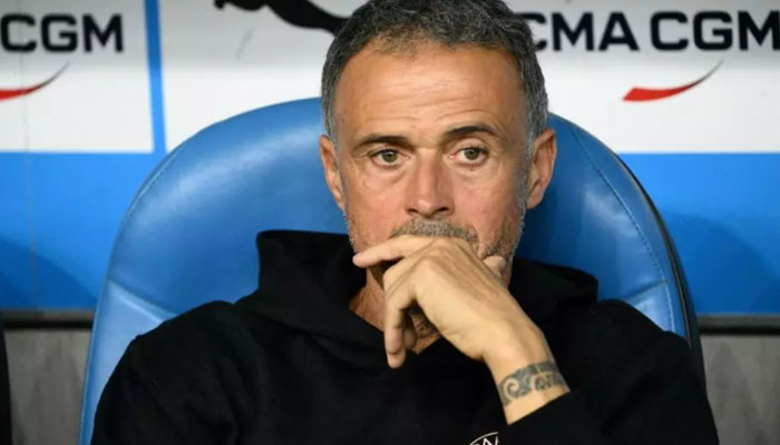 PSG manager Luis Enrique sitting on a chair. — AFP/File
