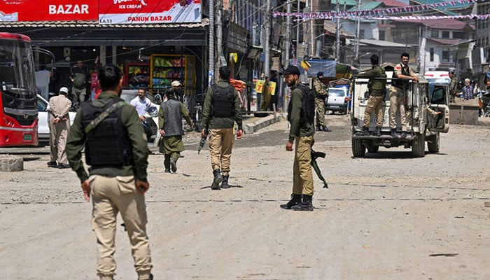 Security personnel patrol during an election campaign rally near Jamia Masjid mosque in Srinagar, Indian Illegally Occupied Jammu & Kashmir (IIOJK) on May 6, 2024. — AFP