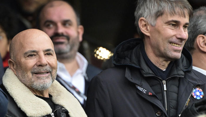 Jorge Sampaoli (L) with Rennes sporting director Frederic Masssara ahead of a Ligue 1 loss to Toulouse.— AFP/File