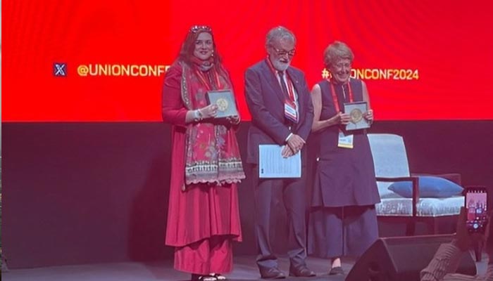 Dr Fatima Razia (left) and Prof Jane Carter (right) pose with their awards for their outstanding contributions towards ending TB at  the opening ceremony of the World Conference on Tuberculosis and Lung Diseases in Bali, Indonesia on November 13, 2024. — Instagram/@sfhcfcsproject