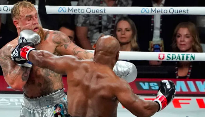 US retired pro-boxer Mike Tyson (right) and US YouTuber/boxer Jake Paul fight during the heavyweight boxing bout at The Pavilion at AT&T Stadium in Arlington, Texas, on November 15, 2024. — AFP