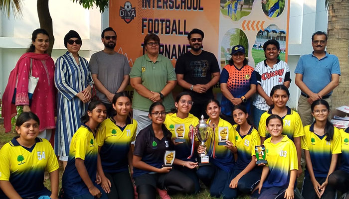 Faculty and students of Haque Academy posing with actor Ali Abbas (top centre) for a photo after  clinching third U16 Girls Inter School Football Championship at the KMC Sports Complex Maidaan on November 18, 2024. — Instagram/@haqueacademy
