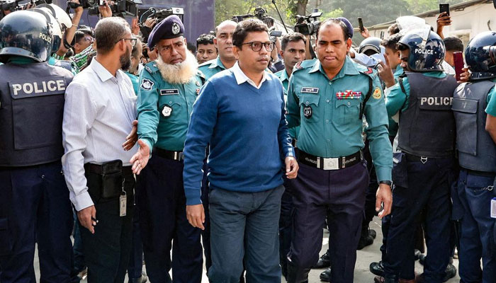 Police personnel escort detainee Zunaid Ahmed Palak (centre), former junior Information Technology Minister and a member of Bangladesh’s ousted former Prime Minister Sheikh Hasina’s Awami League party, to the country’s International Crimes Tribunal (ICT) court in Dhaka on November 18, 2024. — AFP