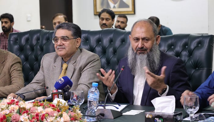 Lesco Chief Shahid Haider (right) gestures as he speaks in a meeting held at the Lahore Chamber of Commerce and Industry on November 27, 2024. — Facebook@lcci.official