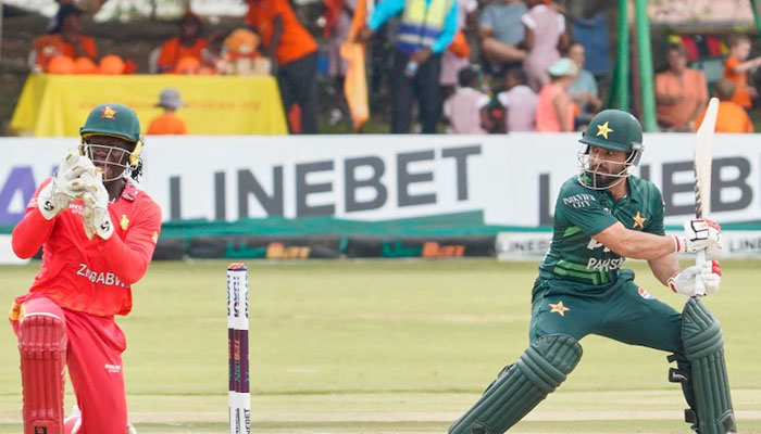 Pakistans Kamran Ghulam (right) looks on as Zimbabwes Gaylord Gumbie catches the ball during 1st ODI. — AFP/File