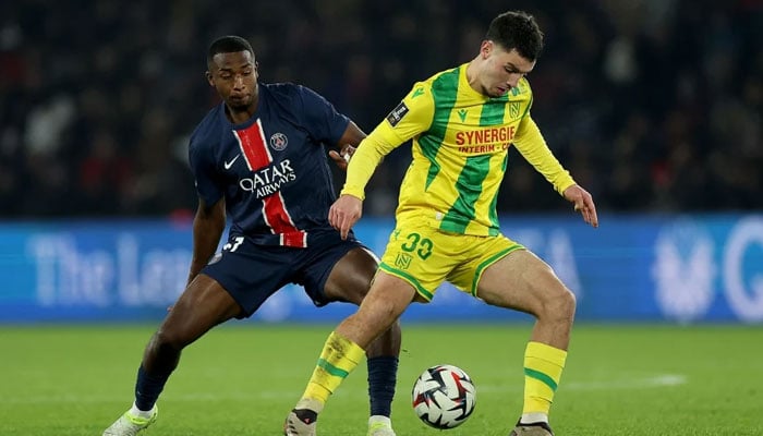 Nantes’ Matthis Abline (right) and Paris Saint-Germain’s Willian Pacho vie for the ball during Saturday’s Ligue 1 match at The Parc des Princes Stadium in Paris. — AFP/File