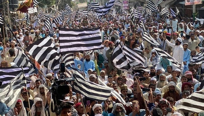 JUI-F supporters hold flags during a party rally in this image released on October 26, 2023. — Facebook@juipakofficial