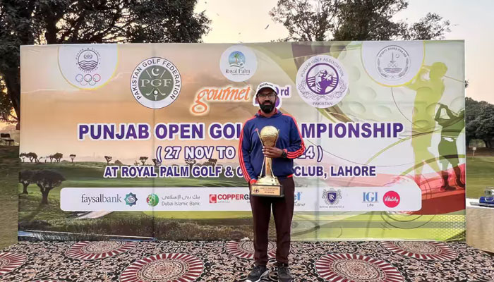 Rawalpindi golfer Minhaj Maqsood poses for photo with a trophy. — Instagram@minhaj_warraich/File
