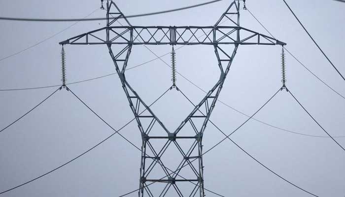 A representational image showing electrical power pylons of high-tension electricity power lines. — Reuters/File