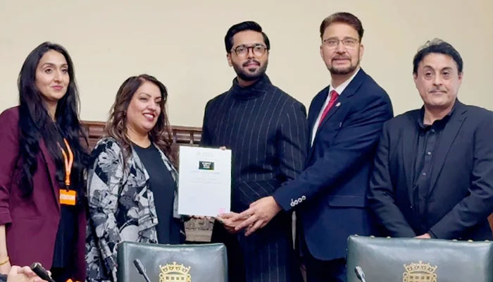 Pakistan actor Fahad Mustafa (centre) receiving an award at the UK House of Commons on December 4, 2024.— Reporter