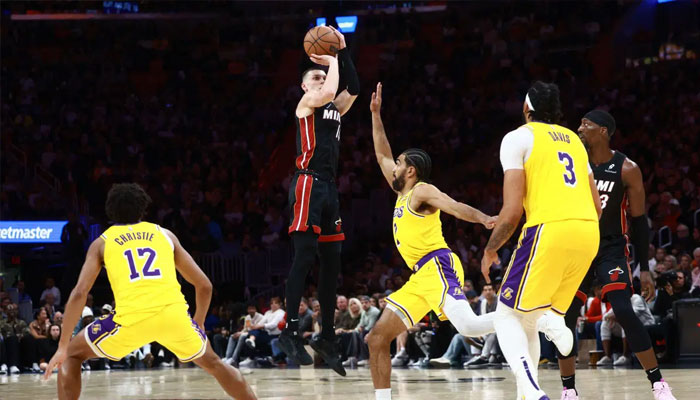 Tyler Herro of the Miami Heat shoots a three point basket against the Los Angeles Lakers during the second half at Kaseya Center on December 04, 2024 in Miami, Florida. — AFP