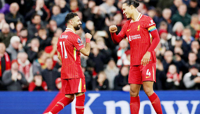 Liverpool’s Egyptian striker Mohamed Salah (left) celebrates with Dutch defender Virgil van Dijk after scoring a goal during an English Premier League match at Anfield in Liverpool on December 1, 2024.— AFP