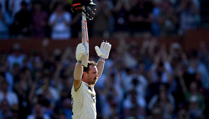Australias Travis Head celebrates after scoring a century on the second day of the second Test against India. —AFP/File