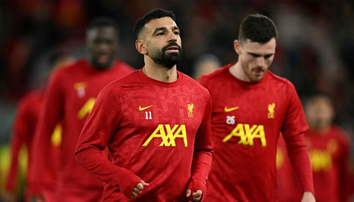 Liverpool’s Egyptian striker Mohamed Salah warms up ahead of the UEFA Champions League football match between Liverpool and Real Madrid at Anfield in Liverpool, north west England on November 27, 2024. — AFP
