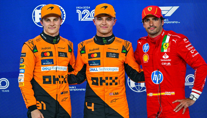 McLaren driver Lando Norris (centre) posing for photo. — AFP/File
