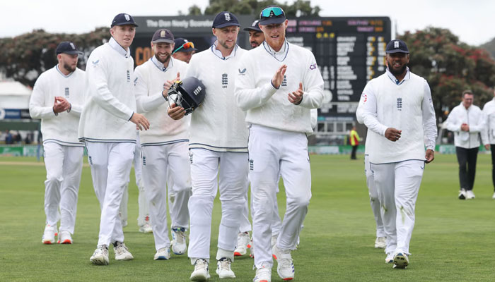 Englands captain Ben Stokes (second from left) leads his team from the field after their match and series win during day three of the second Cricket Test match between New Zealand and England at Basin Reserve in Wellington. — AFP/File