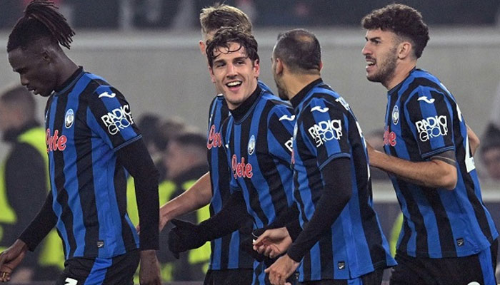 Atalanta’s Italian forward  Nicolo Zaniolo (centre) celebrates scoring after scoring a goal with his teammates.— AFP/File
