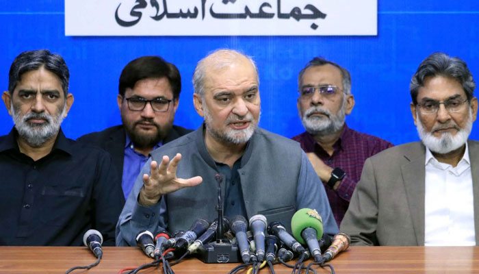 Jamaat-e-Islami (JI) chief Engr Hafiz Naeemur Rehman (centre) addresses media persons during a press conference, at Idara-e-Noor-ul-Haq in Karachi on December 9, 2024. — PPI Images