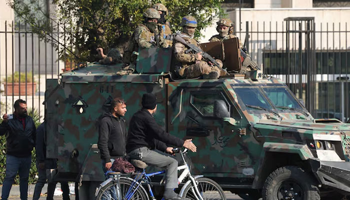 Rebel fighters sit on a vehicle, after rebels seized the capital and ousted President Bashar al-Assad, in Damascus, Syria, December 9, 2024. — Reuters