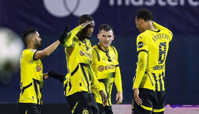 Borussia Dortmunds Guinean forward Sehrou Guirassy (center) celebrates with teammates after scoring his teams third goal during the UEFA Champions League, League phase Matchday 5, football match between GNK Dinamo Zagreb and Borussia Dortmund. —AFP/File