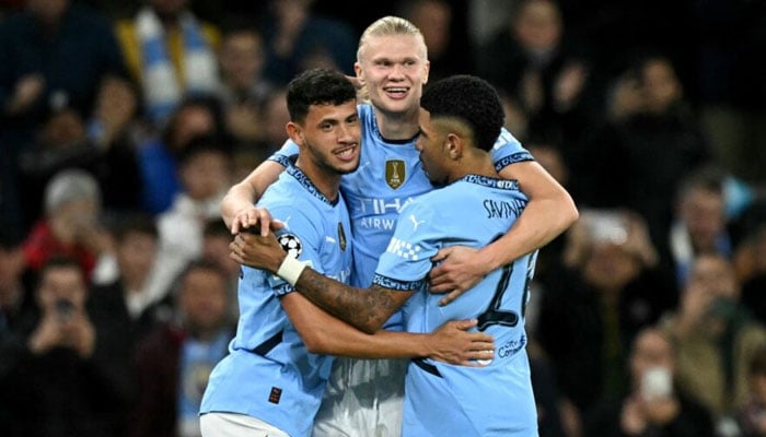 Manchester City’s Norwegian striker Erling Haaland (centre) celebrates scoring the team’s fourth goal during the UEFA Champions League football match between Manchester City and Sparta Prague at the Etihad Stadium in Manchester, north west England, on October 23, 2024. —AFP