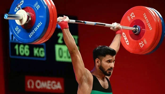 Pakistans Talha Talib is seen lifting weights as part of a competition related to Tokyo Olympics 2020. — Reuters/File