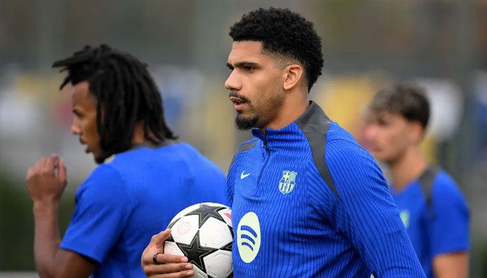 Barcelonas Ronald Araujo can be seen holding football. — AFP/File