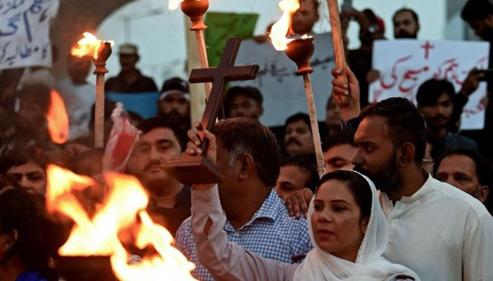 Christians hold a torchlight rally in Karachi. — AFP/File