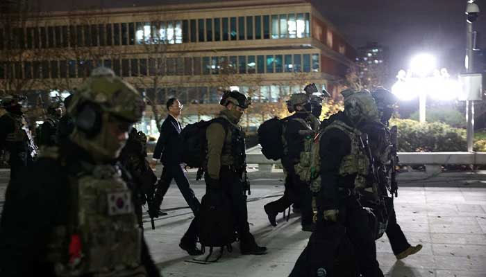 South Korean troops walk outside the National Assembly after President Yoon Suk Yeol declared martial law, in Seoul, South Korea on December 4, 2024. — Reuters