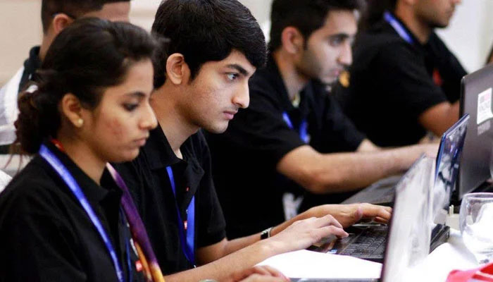 Representational image of young Pakistan students working on their laptops.— The News/File