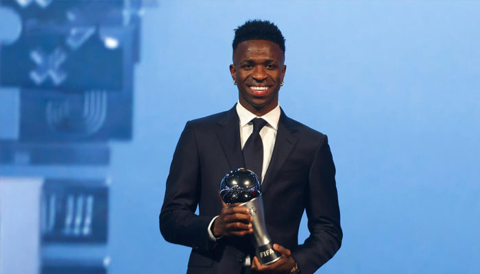 Vinicius Junior posing with the Fifa Best mens player award. —AFP/File