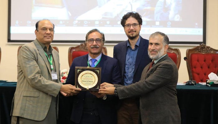 HSAs Prof Shahzad Ali Khan (first left), the Chief Guest, receiving a memento from Prof Shahid Baig (second left) of the PAS along with QAUs Prof Shuja-ul-Mulk (first right) and Germanys Prof Francheska during the ANSO conference. — Reporter