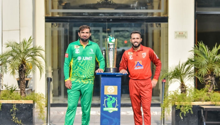 Captains of Stallions (left) and UMT Markhors pose for the photo with trophy. —PCB/File