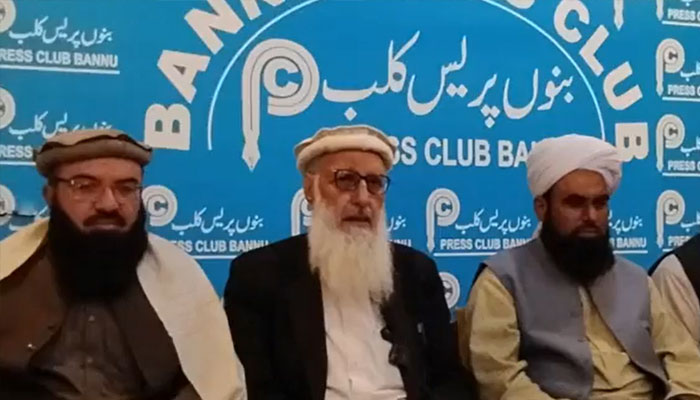 JI leader Prof Muhammad Ibrahim Khan (centre) speaking at a press conference at the Bannu Press Club on December 24, 2024. — ProfMIbrahimKhan